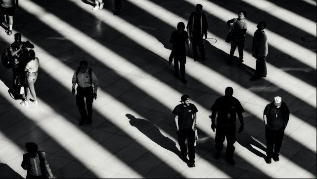 Random People Walking in Shadows